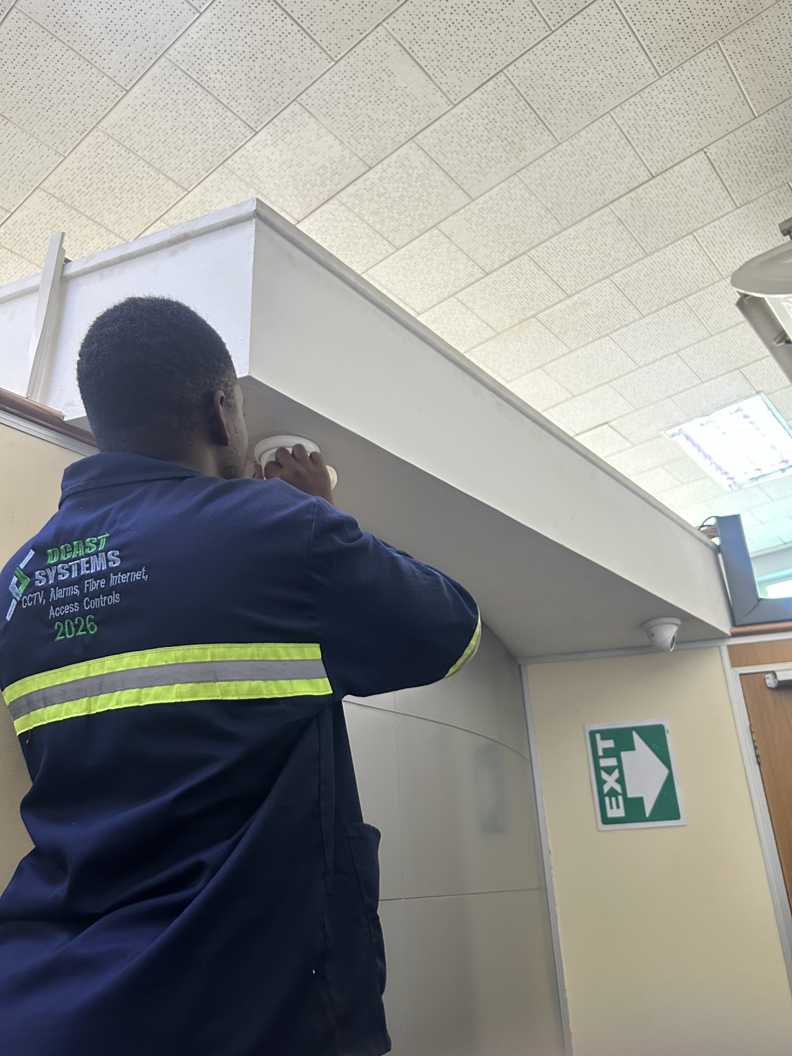 DCAST technician maintaining an indoor security camera