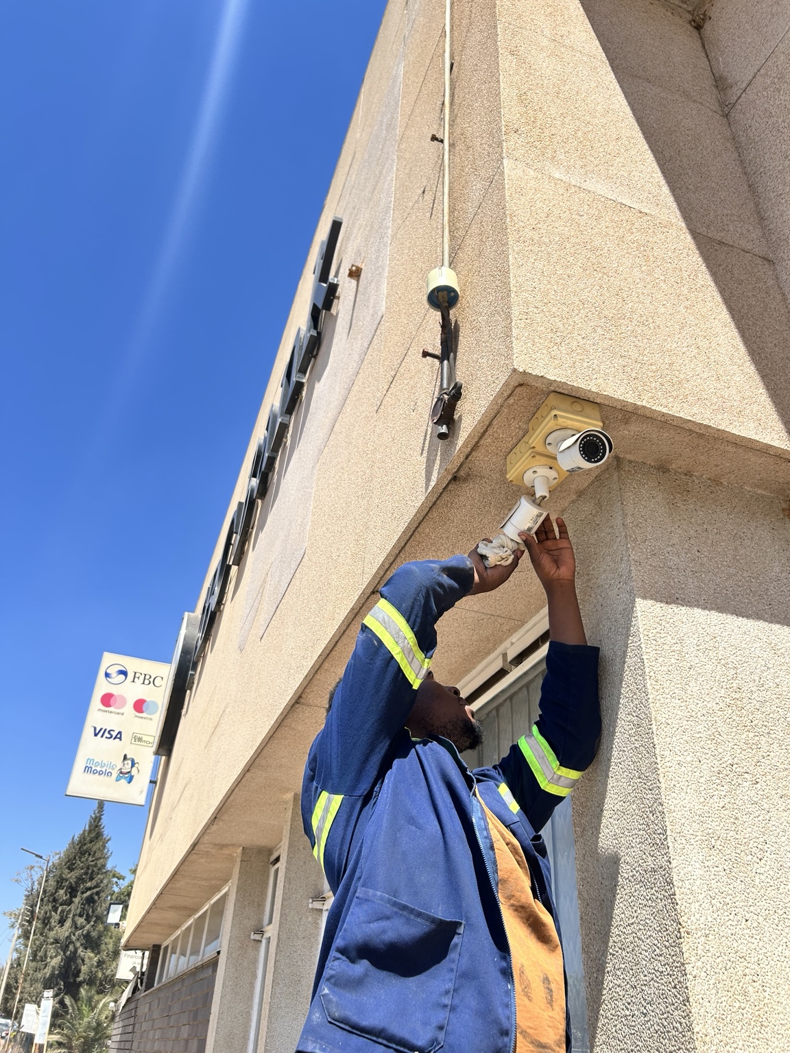 DCAST technician installing outdoor CCTV cameras
