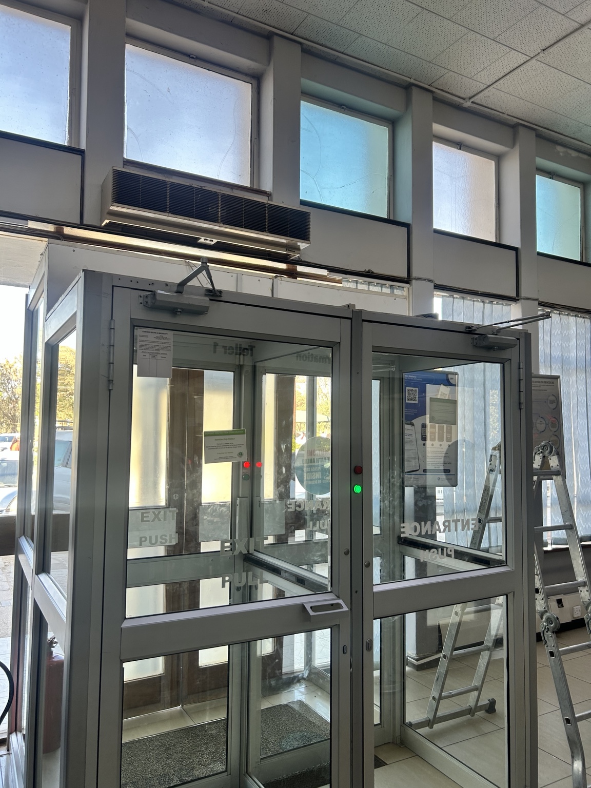 Glass mantrap security doors with controlled entry and exit